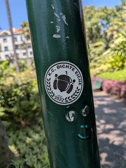 A round sticker featuring a central acorn flanked by two bowling pins, framed by a laurel wreath. Text reads 'K.C. DICHTE EICHE' at the top and '- SINCE - 2022' at the bottom.