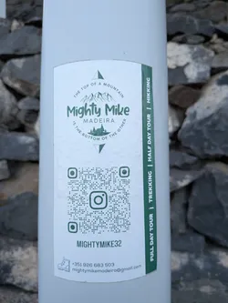 Street sticker A white rectangular sticker with green print. It features a mountain-themed logo at the top, a central QR code with an Instagram icon, contact details at the bottom, and a green vertical stripe on the right listing tour options.