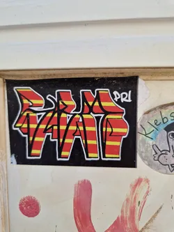 Street sticker A sticker with a bold graffiti-style design. The letters "VAP" are prominently displayed in red and yellow striped lettering on a black background.  A smaller, less distinct "PRI" appears near the top right corner. The style suggests street art or graffiti influence.