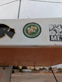 This round sticker shows two characters inspired by the French comic book series Asterix and Obelix. The characters are caricatures with humorous features. One of them looks like Asterix drinking beer while the other is a larger character looking like Obelix holding a large barrel. The text "Section Grand Ouest GROUNDHOPPING" is featured around the image.