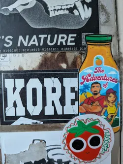 Street sticker A bottle-shaped sticker depicting a cartoon couple against a tropical beach backdrop, featuring the text 'The Adventures of'.