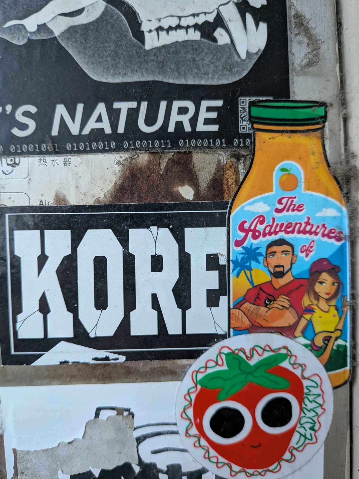 A bottle-shaped sticker depicting a cartoon couple against a tropical beach backdrop, featuring the text 'The Adventures of'.
