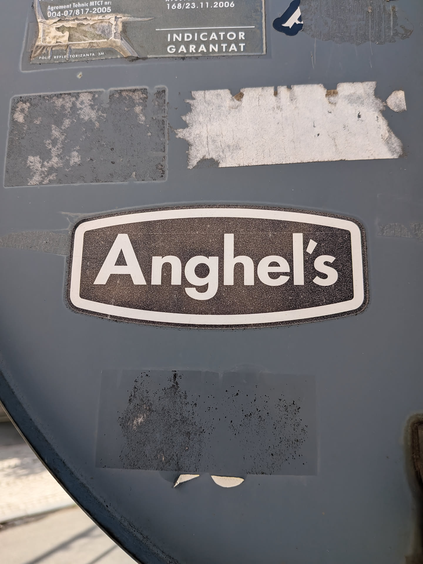 A black, horizontal sticker with a white border, featuring the text 'Anghel's' in a bold, white sans-serif font.