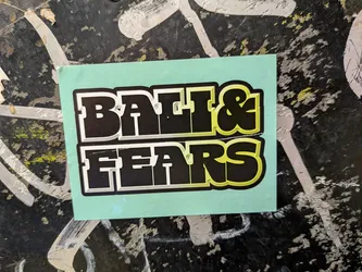 Street sticker Rectangular mint-green sticker featuring bold, blocky text 'BALI & FEARS' in two lines. The black letters have a 3D extrusion effect with a gradient transitioning from white on the left to lime green on the right, outlined in white and black.