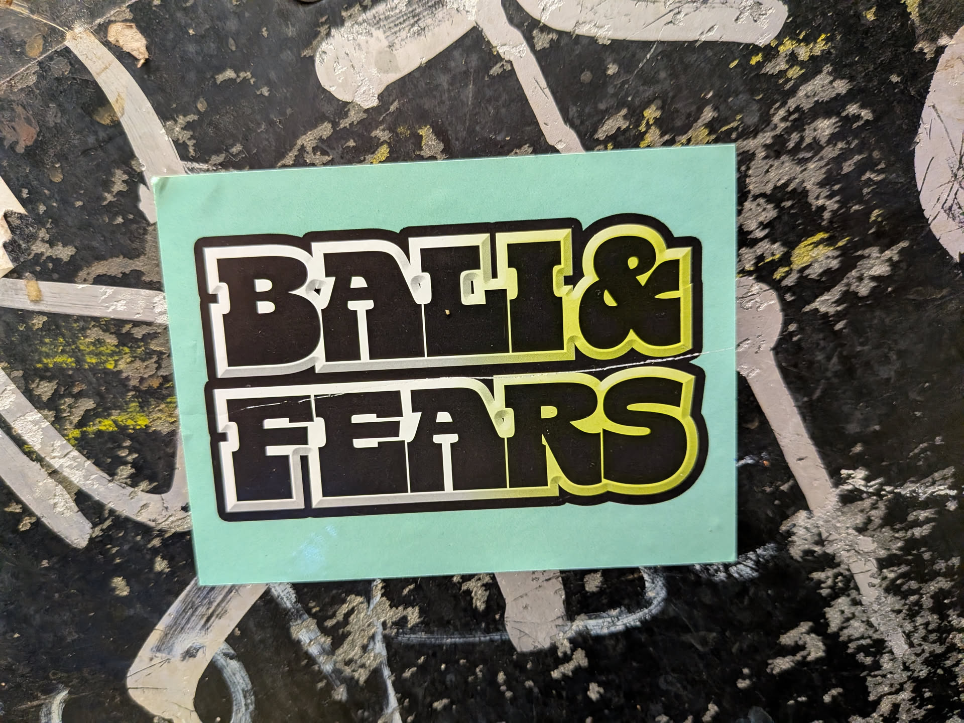 Rectangular mint-green sticker featuring bold, blocky text 'BALI & FEARS' in two lines. The black letters have a 3D extrusion effect with a gradient transitioning from white on the left to lime green on the right, outlined in white and black.