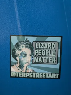 Street sticker The sticker features a stylized portrait of Queen Elizabeth II, but with a significant portion of her face transformed into a reptilian or skeletal visage. Her left eye is a reptilian eye, and the skin on that side of her face appears scaly and grey. Blue, tear-like shapes are depicted falling from her eyes. She is wearing a crown and jewelry. To the right of the portrait, in a grey box with a black outline and a light blue shadow, are the words 'LIZARD PEOPLE MATTER' in bold, white, sans-serif capital letters. The background of the sticker consists of radiating light blue and grey stripes. Along the bottom edge of the sticker, in a similar grey box with a black outline, is the text '@TERPSTREETART'. The overall aesthetic is a blend of regal imagery and a conspiracy theory theme, rendered in a graphic, somewhat distressed style.