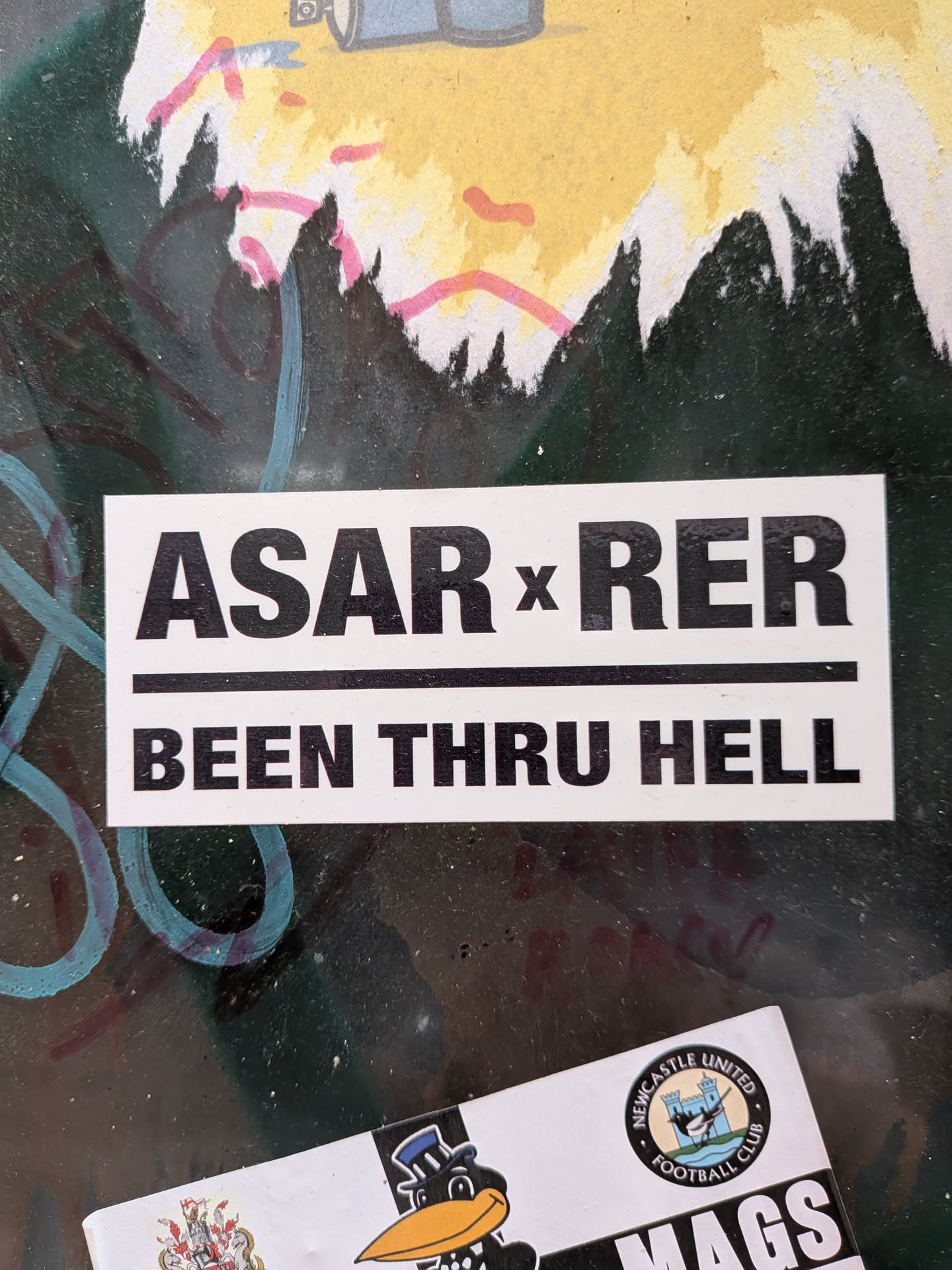 A rectangular white sticker featuring bold black sans-serif text. The top line displays 'ASAR x RER', divided by a solid black horizontal line from the bottom phrase 'BEEN THRU HELL'.