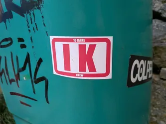 Street sticker A rectangular white sticker featuring a thick red border. Large red letters 'IK' sit in the center, with '10 JAHRE' printed on the top border and 'CREW' on the bottom.