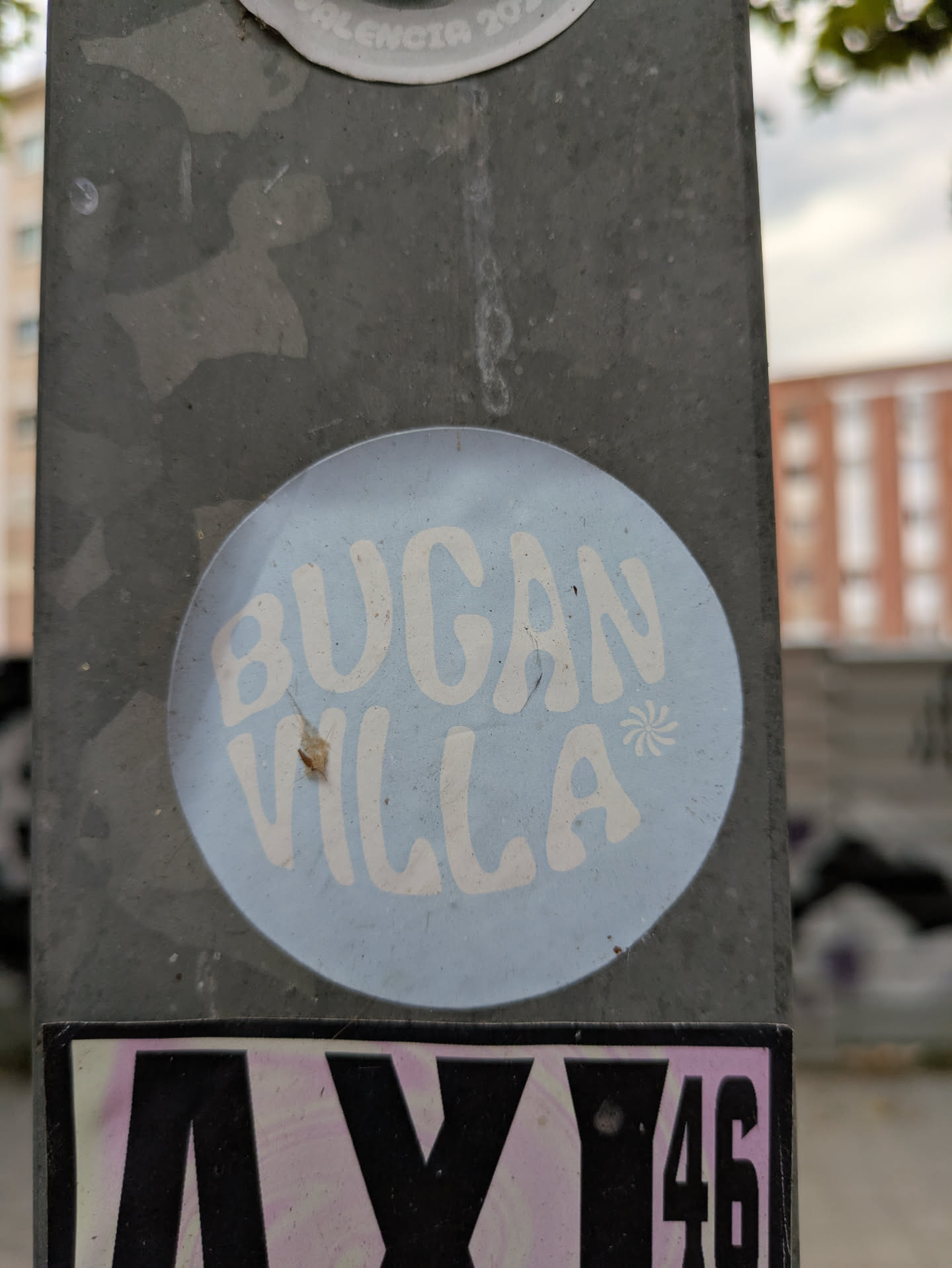 Street sticker This is a round sticker with a light blue background. The text "Bogan Villa" is written in a retro-style, sans-serif font in white color. There's a small asterisk-like design between the words.