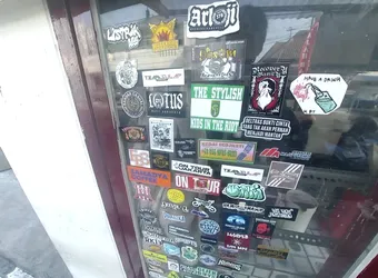 Street sticker A rectangular sticker with green top and bottom bands and a white center. It features the text 'THE STYLISH KIDS IN THE RIOT' and the Persebaya Surabaya shield logo in the middle.