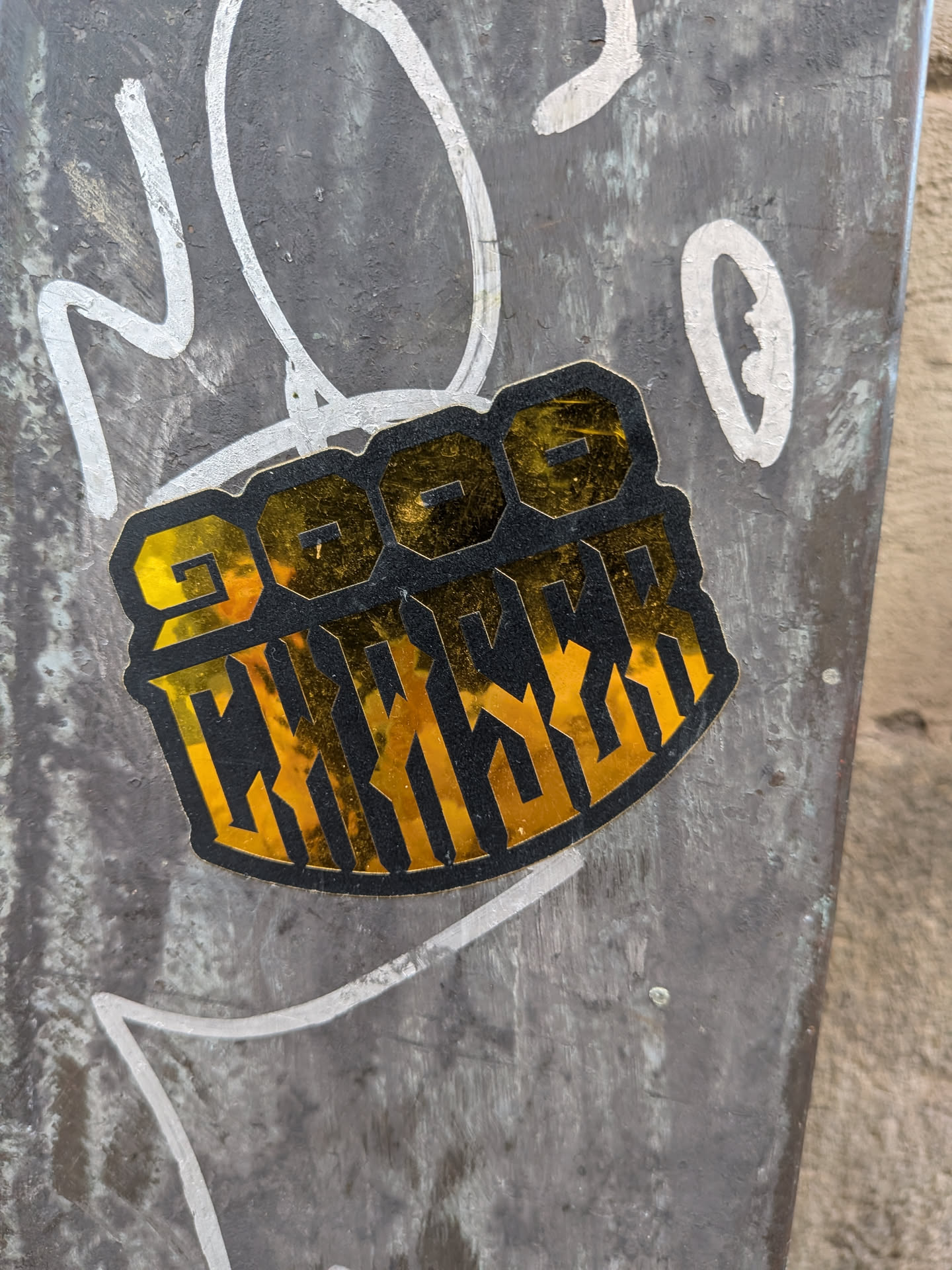 A die-cut sticker with a reflective gold foil base and black textured print. It features the stylized number '2000' on top and the word 'CHASER' below in a bold, vertically elongated block font.