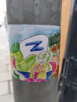 Street sticker Hand-drawn sticker featuring a cartoon scene of people yawning and a speech bubble with the letter Z. The style is childlike and whimsical.