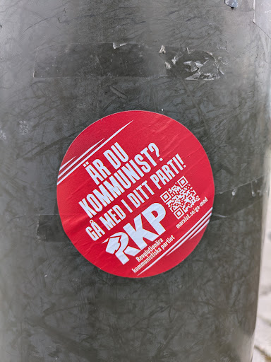 Street sticker A red round sticker promoting the Revolutionary Communist Party (RKP) in Sweden. The sticker contains a QR code linking to marxist.se/ga-med, and includes the party's logo and name.