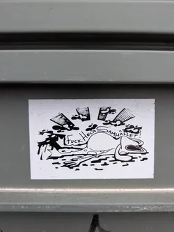 Street sticker The sticker features a cartoonish, seemingly lifeless character with liquor bottles pouring out liquid. The text reads "Fuck Hela Samhället!"
