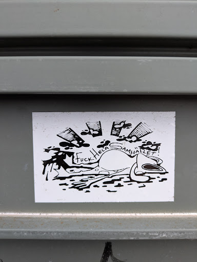 The sticker features a cartoonish, seemingly lifeless character with liquor bottles pouring out liquid. The text reads "Fuck Hela Samhället!"