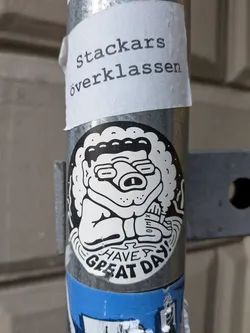 Street sticker The sticker at the center of the image features a monochrome cartoon character with a distinctive, slightly grumpy-looking face. The character has round glasses, a prominent snout with nostrils, and a fluffy, cloud-like outline surrounding its head. It appears to be sitting and holding its arms crossed. Below the character, the words 'HAVE GREAT DAY!' are written in bold, stylized letters. The sticker has a black outline and is mostly white with black detailing, giving it a classic cartoon aesthetic. There is also a small, barely legible symbol on the character's arm. A paper sticker with Swedish text is placed above it.