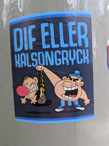 This sticker features two cartoon characters. One character, dressed in blue and white attire and a hat, is pulling another character up by his underwear. The second character has an exaggerated red nose and appears distressed. The text on the sticker reads "DIF ELLER KALSONGRYCK."