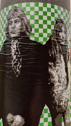 Street sticker This sticker features a stylized depiction of two individuals, possibly musicians or artists, with a vintage aesthetic.  The image is monochromatic with a textured effect suggesting it might be a stencil or screen print. The background is a bold green and white checkerboard pattern.