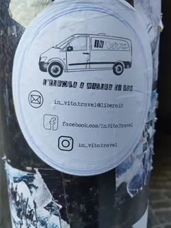 Street sticker Sticker for In Vito travel agency.  It depicts a van and includes contact information: email, Facebook, and Instagram.