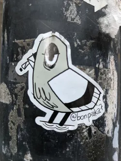Street sticker A sticker featuring a stylized bird design. The bird is depicted in grayscale with a simple yet expressive style.  The artist's Instagram handle is visible on the sticker.
