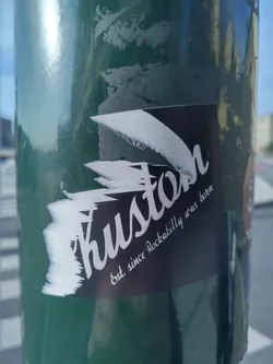 A black and white sticker with the word "Kustom" in a stylized font.  The text "Est since Rockabilly was born" is also visible below the main word.