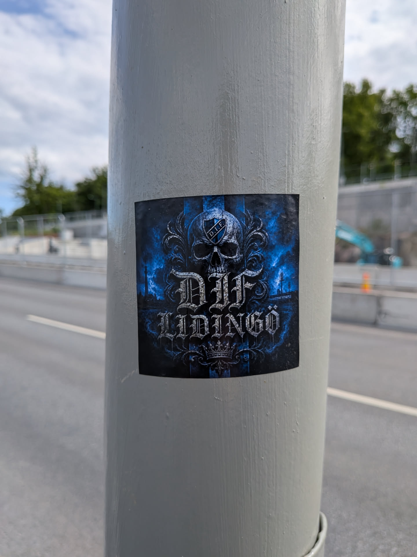 Square sticker with a dark gothic theme. Features a central skull with a 'D.I.F.' shield on its forehead, above stylized metallic text reading 'DIF LIDINGÖ'. The background is textured dark blue and black.
