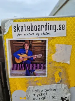 Street sticker Sticker featuring Johan Norborg playing an acoustic guitar.  The sticker also includes the website skateboarding.se with the tagline "for skaters by skaters".