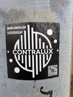 Street sticker This sticker features the CONTRAUX logo in white against a black background. The logo is composed of vertical bars arranged in a semi-circle, creating a sound wave or equalizer effect. Above the logo, 'DRUM AND BASS STOCKHOLM' is printed in a smaller font. There is a qr code on the bottom right.