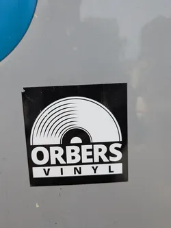 Street sticker A square black sticker depicting a white stylized vinyl record graphic. Below it, the text 'ORBERS' is printed in bold white, with 'VINYL' in black inside a white rectangular box.