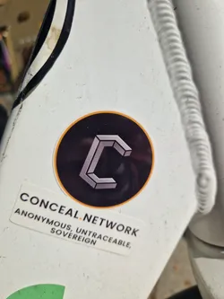 Street sticker The sticker features the logo of Conceal Network, which is a stylized 'C' within a black circle with an orange border. Below the logo, the text 'CONCEAL.NETWORK ANONYMOUS, UNTRACEABLE, SOVEREIGN' is printed on a white rectangle sticker.