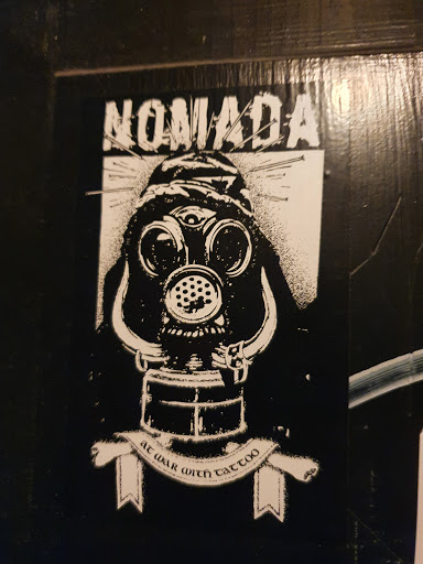 Street sticker Stockholm NOMADA At war with tattoo