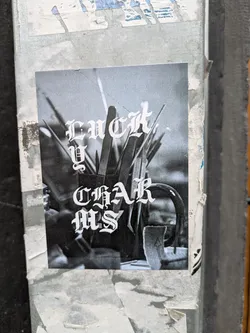 Street sticker Black and white photo sticker with the text "LUCKY CHARMS" in a gothic style font. The photo depicts a collection of items in a mug or container.