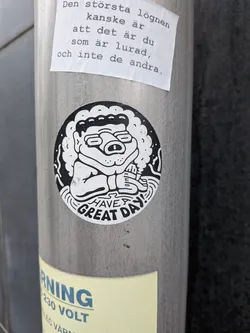 Street sticker A circular sticker featuring a black and white cartoon character with curly hair and glasses, holding a marker. The bottom edge reads 'HAVE A GREAT DAY!' in stylized uppercase letters.