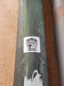 Black and white sticker with a coat of arms.  It says SUDRA DIVISIONE and STHLM. MMXI is also visible.