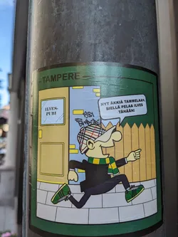 A sticker featuring a cartoon character running towards Ilves Pubi in Tampere. The text in the speech bubble says: "New game at Tammela, Ilves plays there today". The year 1981 is visible in the background.
