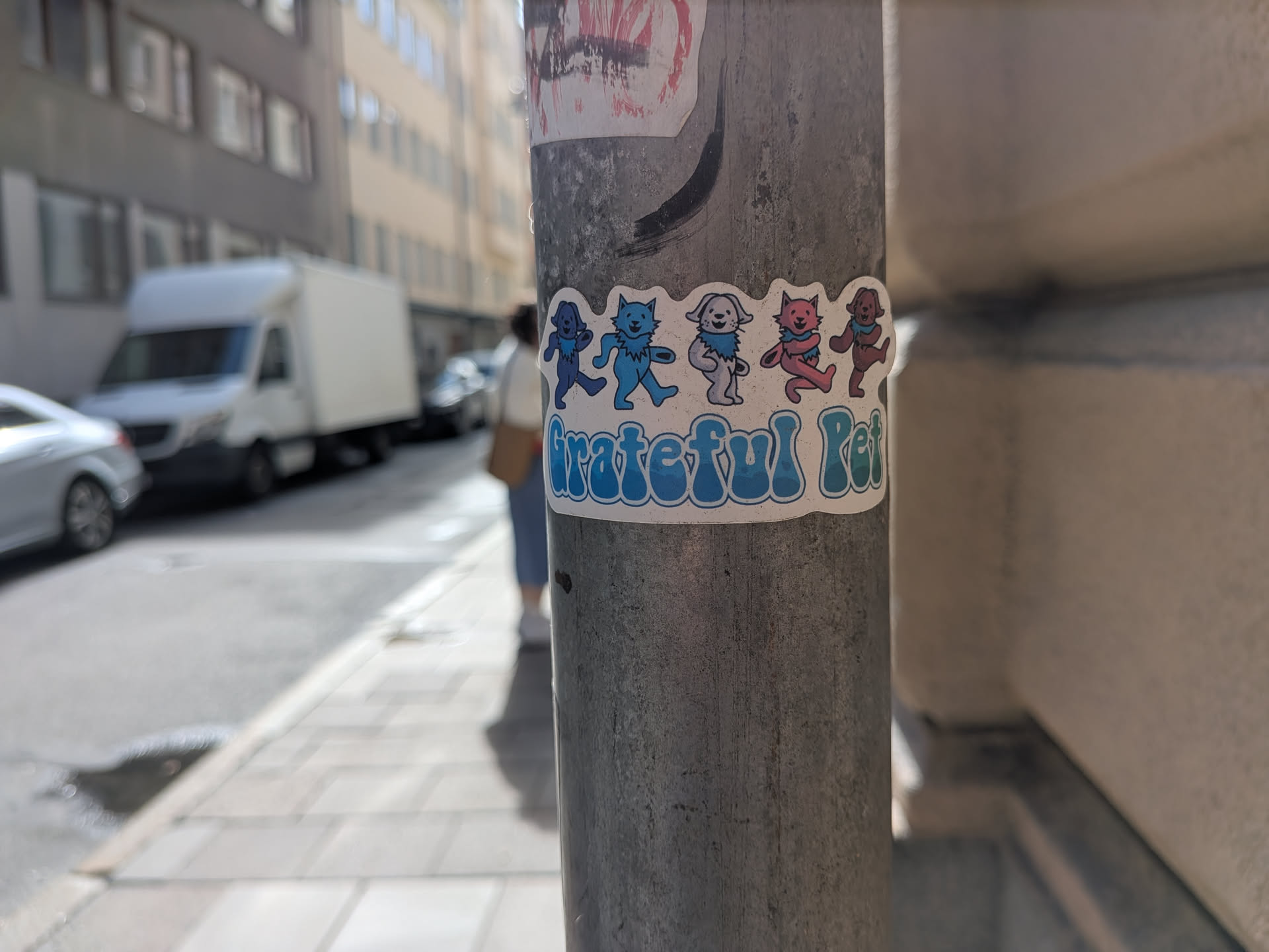 A die-cut sticker showing five colorful dancing pets styled after the Grateful Dead bears. Below them, the words 'Grateful Pet' are written in a bubbly, retro blue-green font.