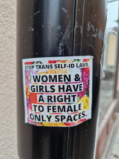 Street sticker STOP TRANS SELF-ID LAWS. WOMEN &amp; GIRLS HAVE A RIGHT TO FEMALE ONLY SPACES.