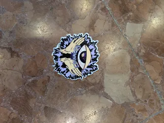 Street sticker The sticker prominently features a central eye with a dark, cosmic-looking iris depicting what appears to be a galaxy or starry nebula. Two light-skinned hands are positioned, one above and one below, seemingly reaching towards or framing the eye. The entire design is set against a jagged, energetic burst pattern in shades of light purple and black, with a white outline. The aesthetic suggests themes of mysticism, spirituality, or cosmic vision.