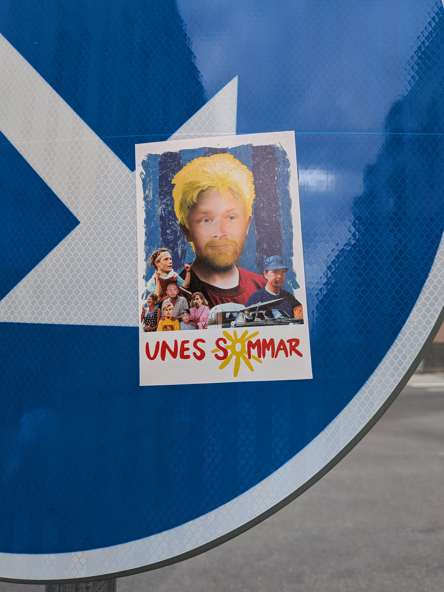 Rectangular sticker parodying the 'Sunes sommar' movie poster. Features a central man with edited yellow hair and beard, surrounded by characters from the film. The text 'UNES SOMMAR' is printed at the bottom in red with a yellow sun.