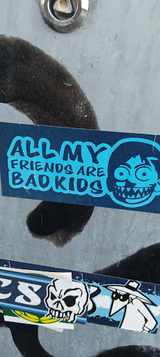 A blue and white sticker featuring the text 'All My Friends Are Bad Kids' next to a cartoon face with jagged teeth and wide eyes.