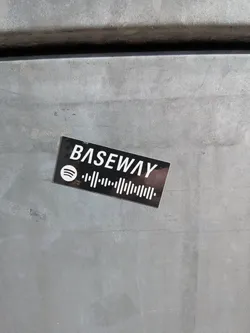 Street sticker A rectangular sticker with a black background. White text reading 'BASEWAY' is prominently displayed at the top. Below the text is the Spotify logo, followed by a Spotify code, which is a black and white barcode-like pattern used to link directly to music on the Spotify platform.
