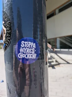 Street sticker A circular sticker with a vibrant deep blue background. The text "STOPPA HYRES-CHOCKEN!" is prominently displayed in bold, white, sans-serif capital letters. The words are stacked, with "STOPPA" at the top, "HYRES-" in the middle, and "CHOCKEN!" at the bottom, all centered. The design is simple, direct, and impactful, typical of a protest or campaign message.