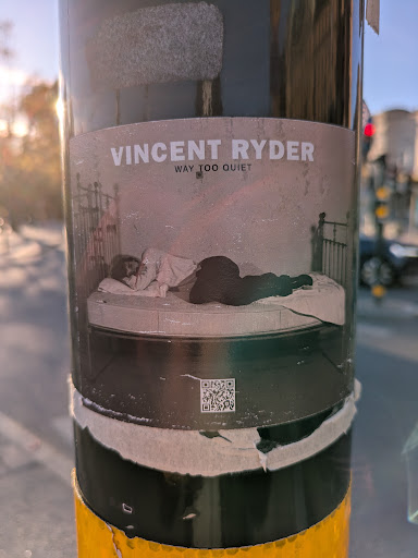 Street sticker The sticker promotes Vincent Ryder's "Way Too Quiet" album and shows an image of two people in bed. There is also a QR code at the bottom left corner.
