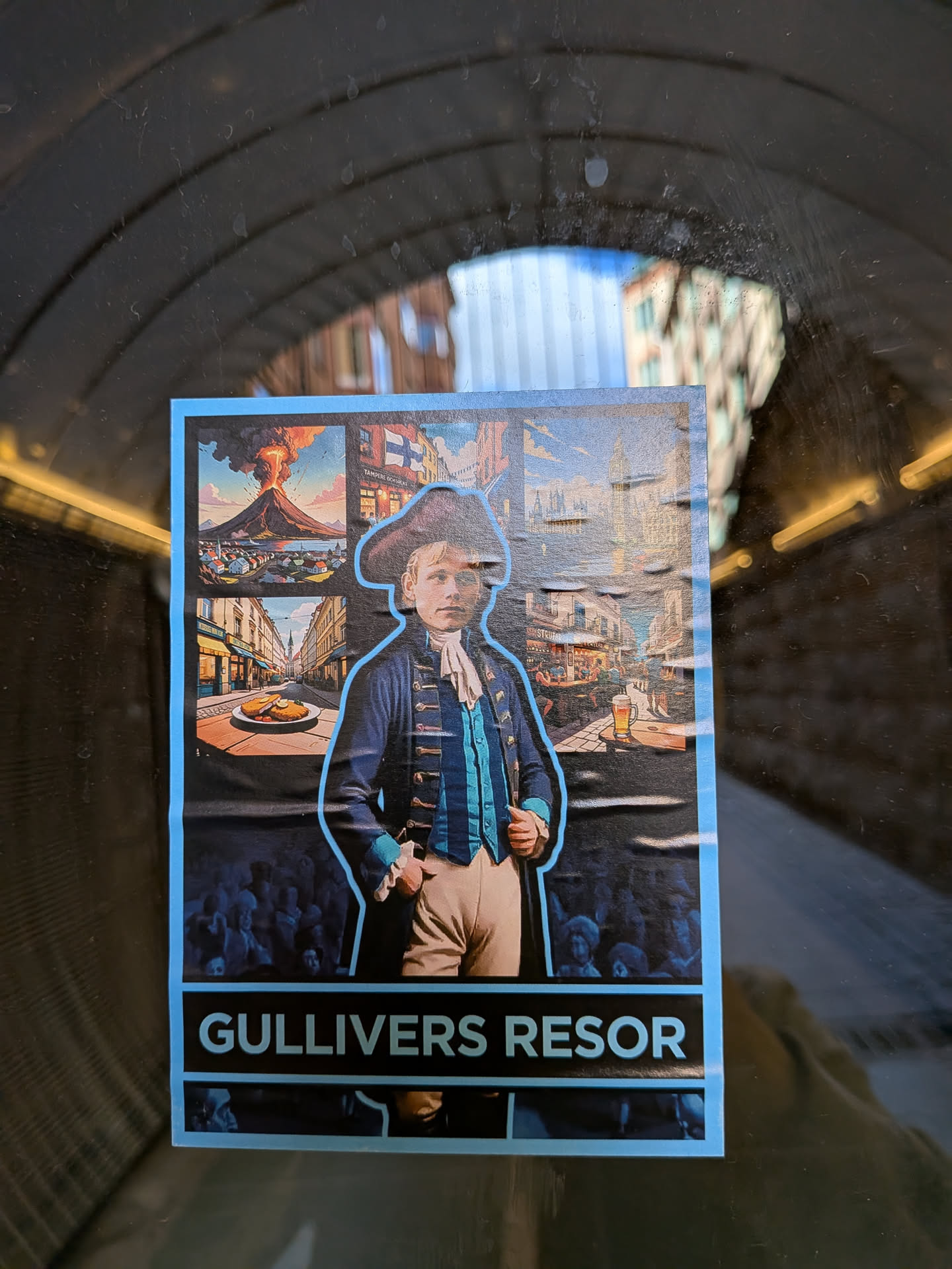 A vertically oriented rectangular sticker with a light blue border, featuring a central illustration of a young boy in historical attire, including a tricorn hat, blue coat with gold buttons, and white cravat, outlined in bright light blue. He stands against a dark background with faint, shadowy silhouettes of people looking up at him. Surrounding the central figure are several smaller, framed illustrations: a dramatic volcanic eruption over a town, a European city street with a Finnish flag and partial text 'TAMPERE DOKKARI', a street scene with a plate of food (possibly schnitzel), and another bustling street with a glass of beer. The overall aesthetic is illustrative and detailed, combining elements of adventure and travel. A black band at the bottom displays the white capital text 'GULLIVERS RESOR'.
