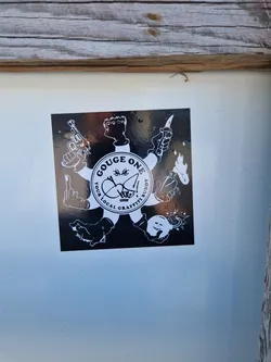 A black and white sticker featuring a central circular logo that says "Gouge One: Your Local Graffiti Buddy."  Surrounding the logo are various illustrations of hands holding weapons (guns, knives), a Molotov cocktail, and a bomb. The style is graphic and bold.