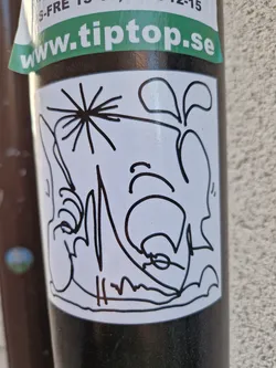 A white sticker with a black ink drawing of a character that looks like a combination of a face and a plant. The style is simple and expressive, with visible brushstrokes giving a hand-drawn quality. There is a small signature-like mark at the bottom.