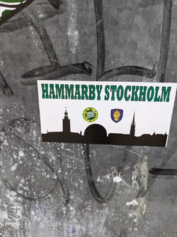 Street sticker A sticker depicting a skyline of Stockholm, Sweden, with the text "Hammarby Stockholm" at the top.  There are three logos underneath the text, possibly representing different organizations or clubs related to Hammarby.