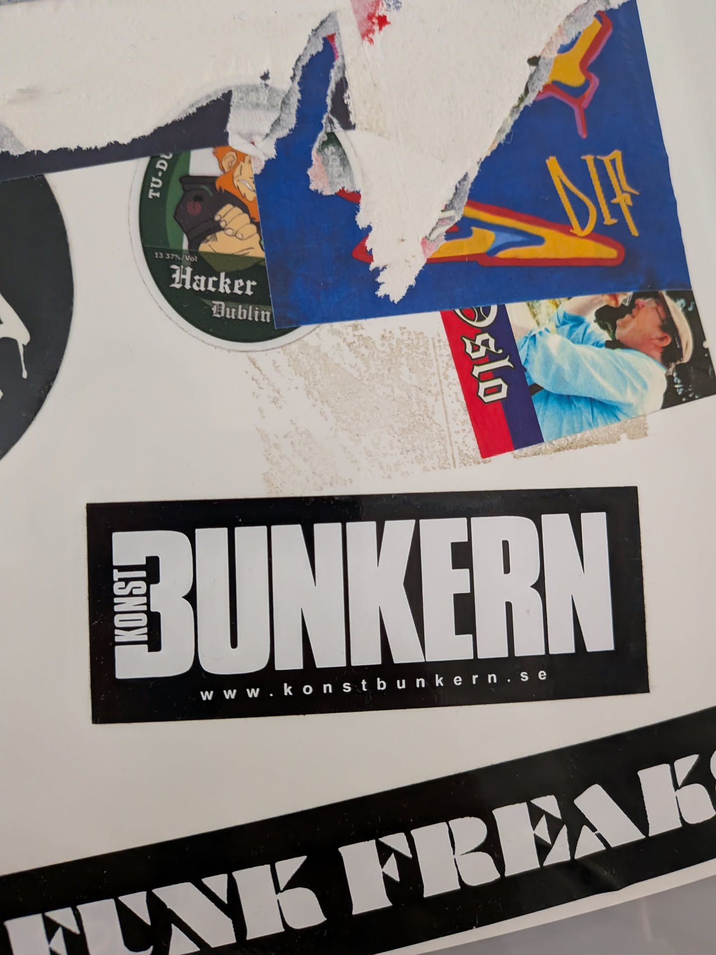 A rectangular black sticker featuring prominent white typography. The word 'KONST' is stacked vertically along the left edge, while 'BUNKERN' is displayed horizontally in large, bold, sans-serif letters to its right. Below 'BUNKERN', a website address 'www.konstbunkern.se' is printed in smaller white sans-serif text. The design is clean, modern, and high-contrast.