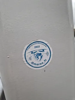 Street sticker Round sticker featuring Mareo FC logo, text, and hashtags. The sticker is white with blue text and logo.