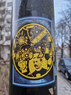 Street sticker A round sticker featuring the logo of AIK Fotboll, a Swedish football club. The sticker is primarily yellow and black with images of historical figures and the year 1891, which represents the club's founding year. The design is detailed with various visual elements, and the colors are bold and striking.